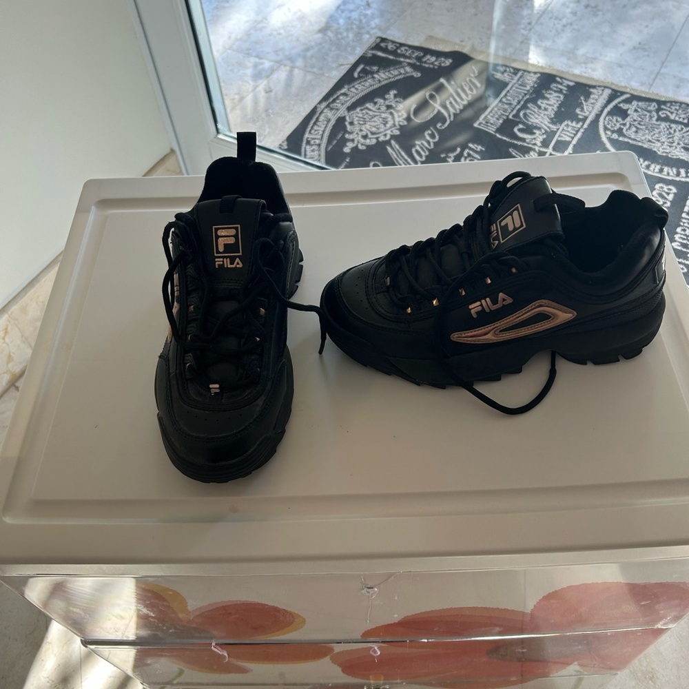 Fila women’s black & gold sneakers